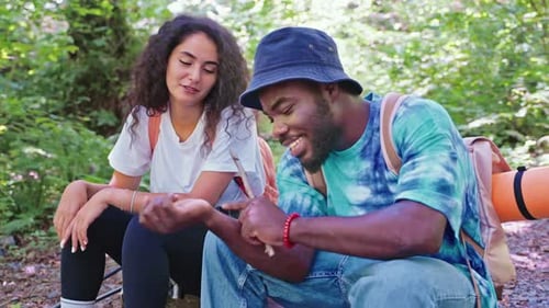Couple Chatting in Forest on Hiking Trip