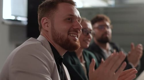 Business Professionals Clapping in a Corporate Setting