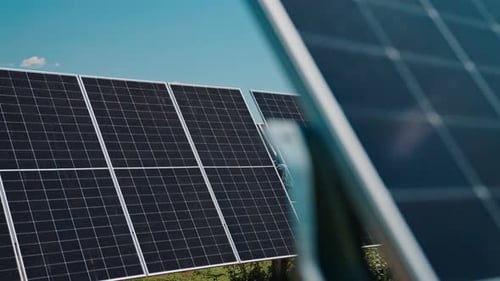 Solar Panels in Sunny Field Capturing Clean Renewable Energy