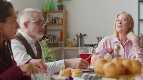 Friends and Family Gathering Around Table for Meal