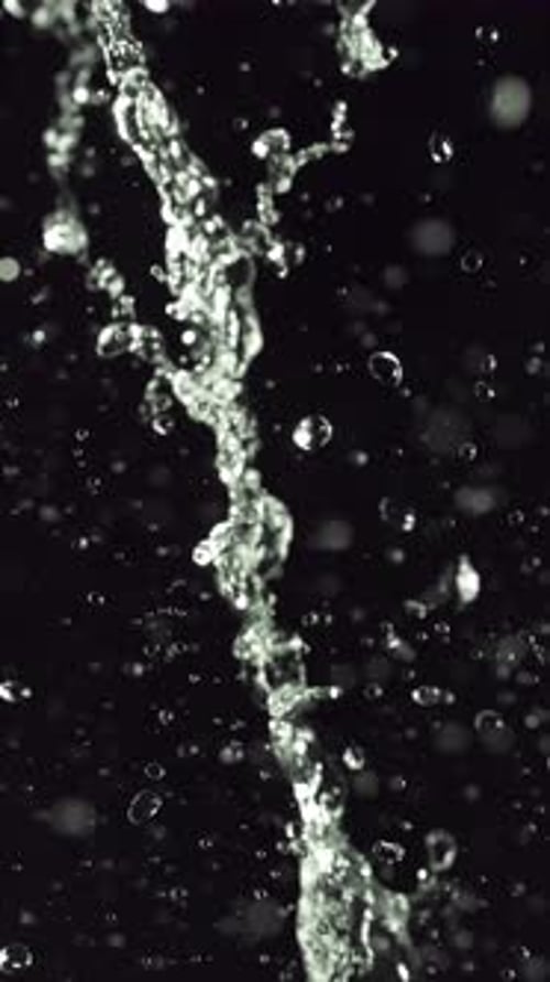 Water Splashes and Droplets on Black Background