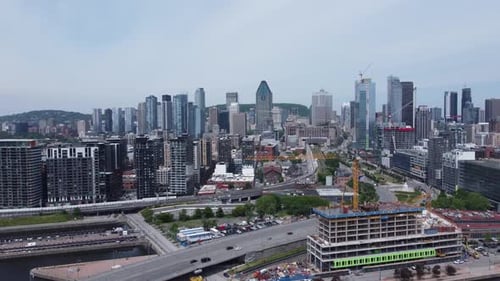 Aerial view of modern city skyline of Montreal Quebec Canada, drone fly above smart city with traffi