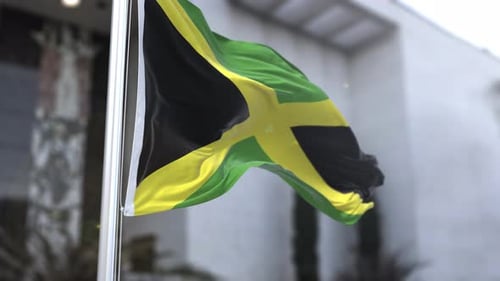 Realistic Jamaican Flag Waving on Flagpole