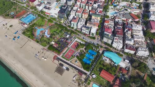Aerial Video of a Large Park With Sports Courts Fountains Green Palm Trees and a Stunning View of