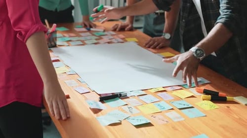 Team Brainstorming Ideas Together in Modern Office