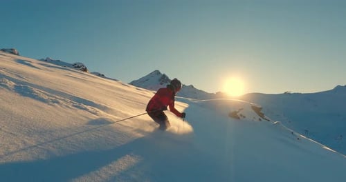 Professional Skier Freeriding Through Fresh Powder Snow in the Swiss Alps