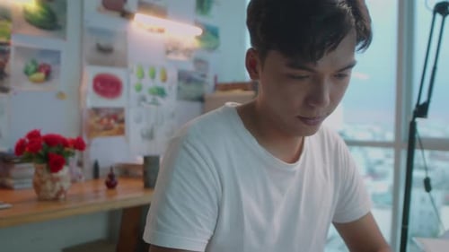 Young Artist Sketching at Bright Workplace