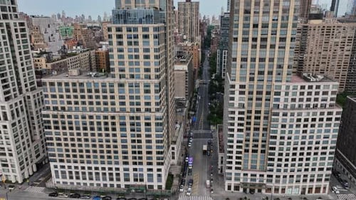 An aerial view of a city with tall buildings