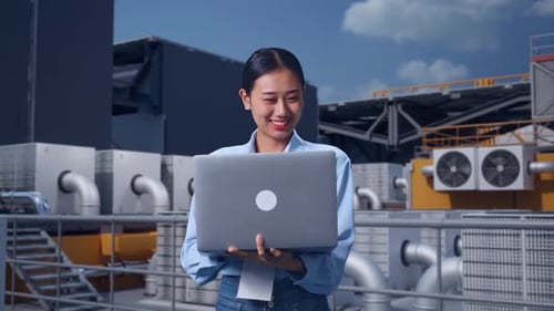 Asia Female Professional Worker Working With A Laptop On Rooftop HVAC