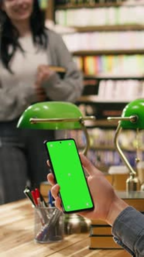 Vertical Video Isolated Green Screen on Laptop Near Study Group at Library Desk