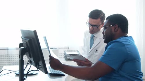 Doctor and Surgeon Talking Near Window Medical Workers in Hospital Office Day Light Healthcare