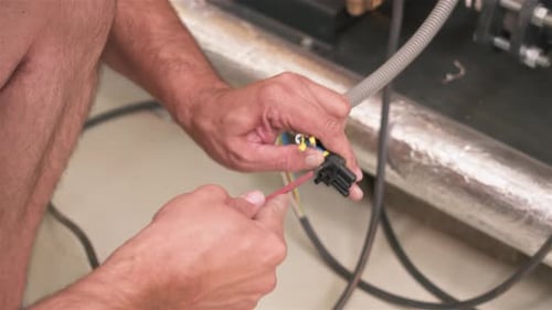 Electrician Connects Cables to Device, Males Hands Worker