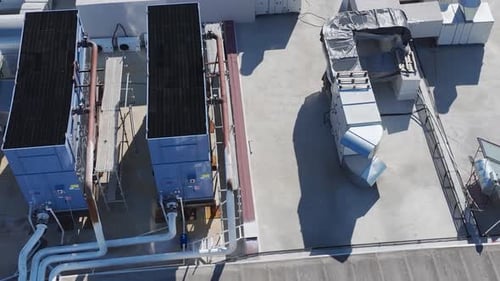 Aerial Video Industrial Air Conditioning Systems Installed on a Building Roof Captured Aerially