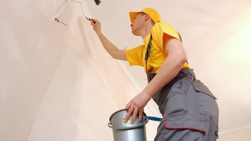 Builder Paint the Wall with Wallpaper Glue