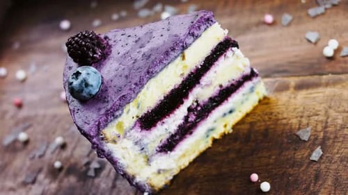 Slice of Berry Cake with Colorful Decorations