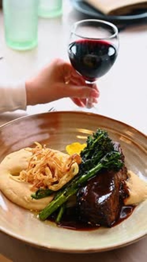 Braised beef rib served with red wine in restaurant.