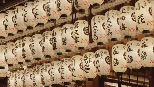Many japanese lanterns hanging at Yasaka Jinja during nighttime in Gion, Kyoto, Japan.