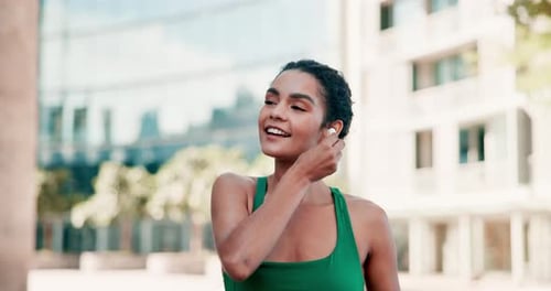 Earphones, fitness and happy woman in city for training, running or morning cardio with music