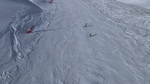 Aerial View of Skiers on Snowy Mountain Slope
