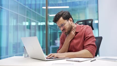 Man Working Experiences Sudden Painful Sore Throat