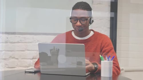 Young Adult on Video Call in Modern Office