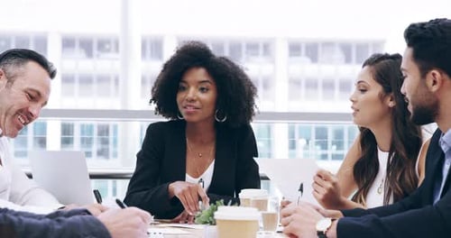 Diverse Team Discusses Business in Modern Office