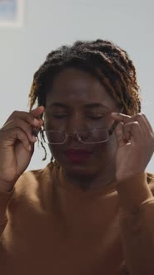 Adult Woman Smiles Wearing Glasses in Portrait Video