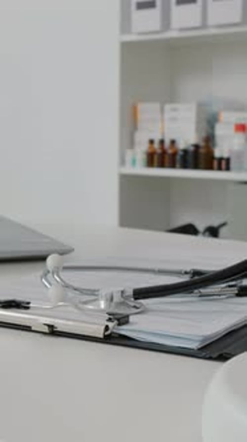 Close Up of Stethoscope Resting on Medical Chart