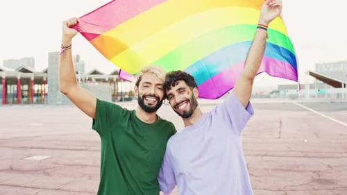 Gay Couple Celebrate Pride with Rainbow Flag
