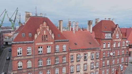 Large Brick Building with Many Windows in Aerial View