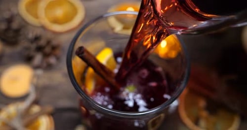 Mulled Wine Pouring on a Holiday Table