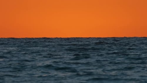 Dramatic Bright Red Sky at Ocean Sunset Soft Evening Clouds Over Sea Dark Water