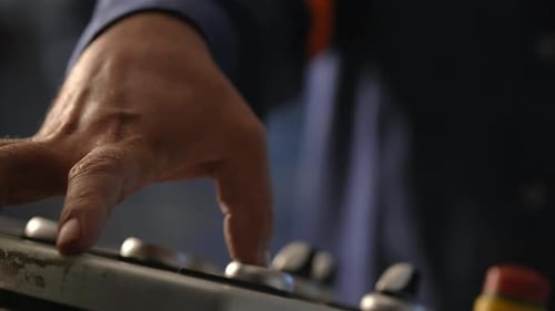 Closeup Of A Worker Pressing Buttons On A Industrial Manufacturing Production