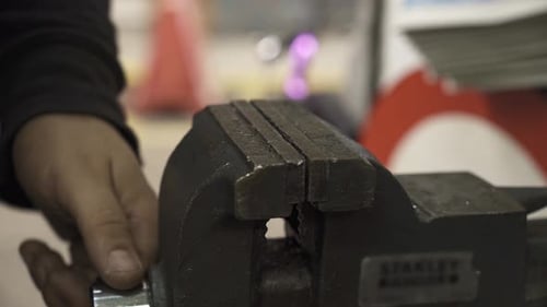 bicycle mechanic tightening vise close-up