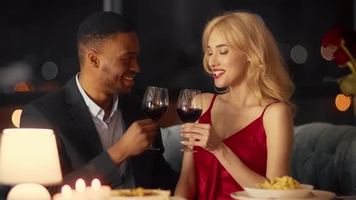 Couple Enjoying a Romantic Evening Together While Dining at a Restaurant