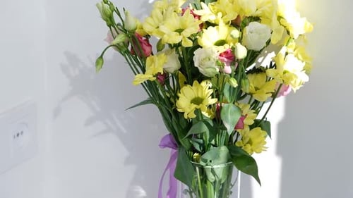 Easter Colorful Eggs in Busket on White Wooden Table