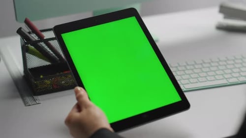 Manager Using Mockup Tablet with Green Screen Closeup. Hands Hold Chroma Key