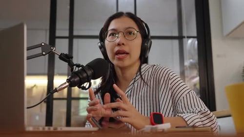 Woman Recording Podcast at Home Studio with Laptop