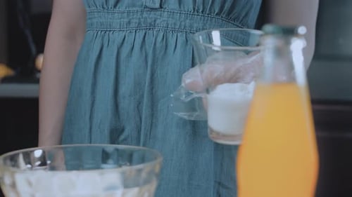 Woman Preparing Food Dish in Home Kitchen