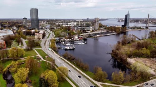 Aerial View of Modern City with River and Nature