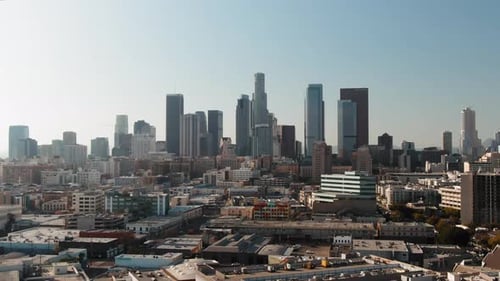 Establishing shot of Los Angeles Skyline in Bright Sunlight, Aerial Pullback shot