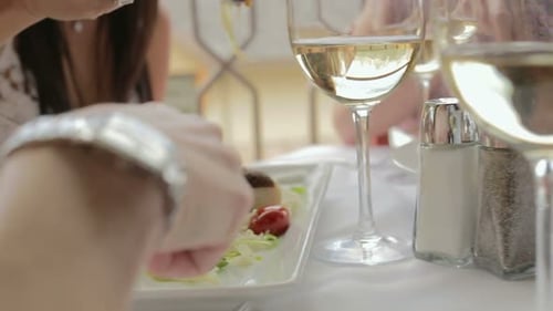 Women Sharing Appetizers at Restaurant Table CU Shaky LR Pan Pan Up
