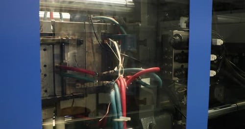 Details Of Plastic Injection Molding During Operation In A Manufacturing Industry. close up