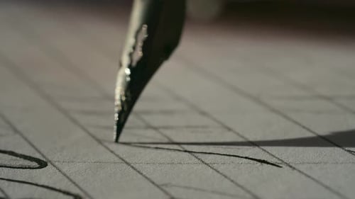 Calligrapher Using Vintage Fountain Pen Writing on Paper