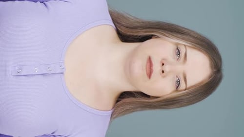 Young Woman Stares into the Camera, Close Up