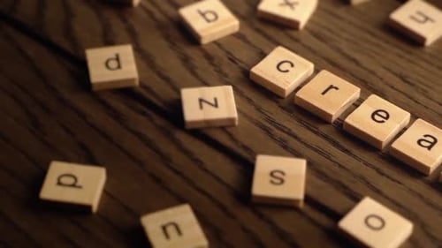 Letter Tiles Spelling Create on Wooden Background