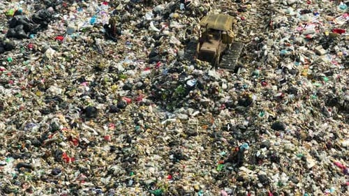 An aerial view over a landfill. 4K.