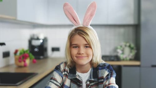 Happy Easter Portrait of the Cute Little Blonde Boy Wearing Bunny Ears Headband Sitting in the