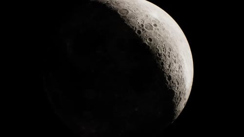 Waxing Crescent Moon Over Dark Sky with Detailed Surface Features