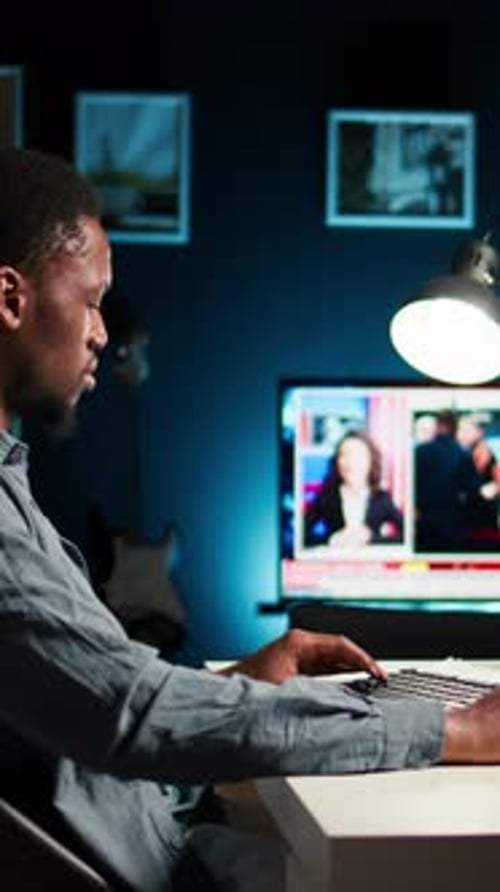 Vertical Video Young Man Video Editor Works on Editing Film Footage at Home Setup